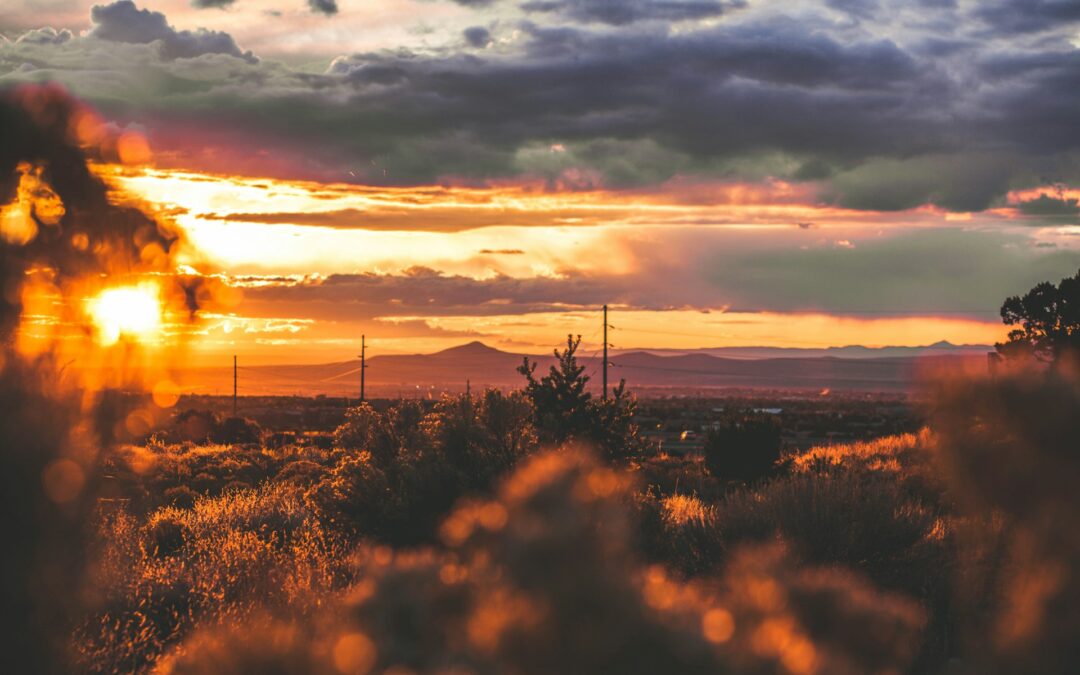 Sun setting over a landscape view of the City of Santa Fe skyline